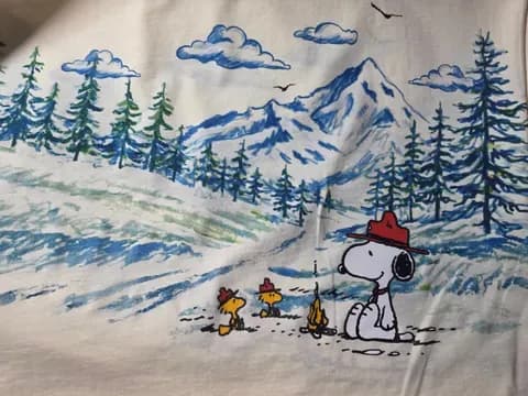 Cartoon dog in red hat with birds in snowy landscape