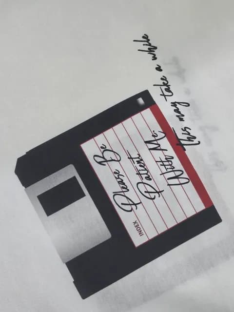 T-shirt print with floppy disk and handwritten text design